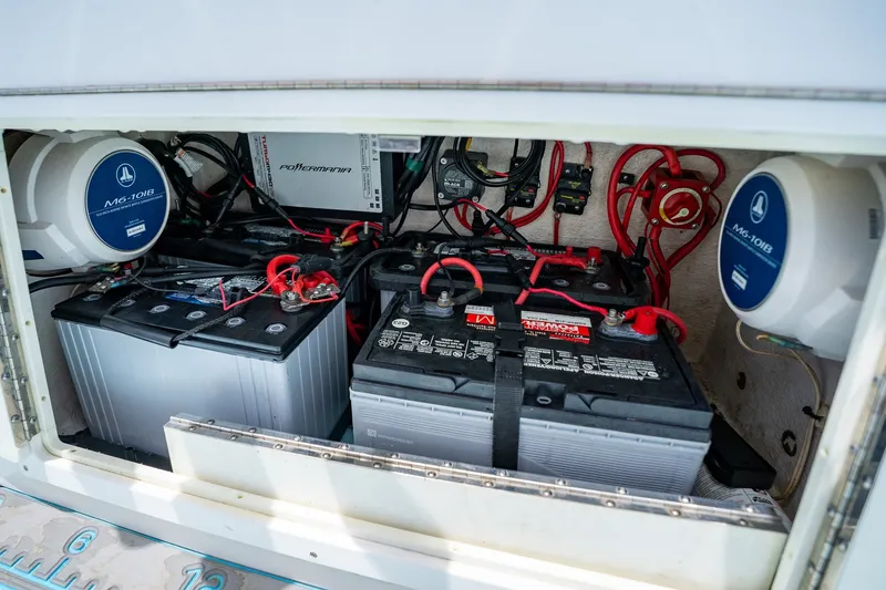 Slide: The Image of Battery compartment of 2018 Dorado 25 SE boat with wiring and components. - 55