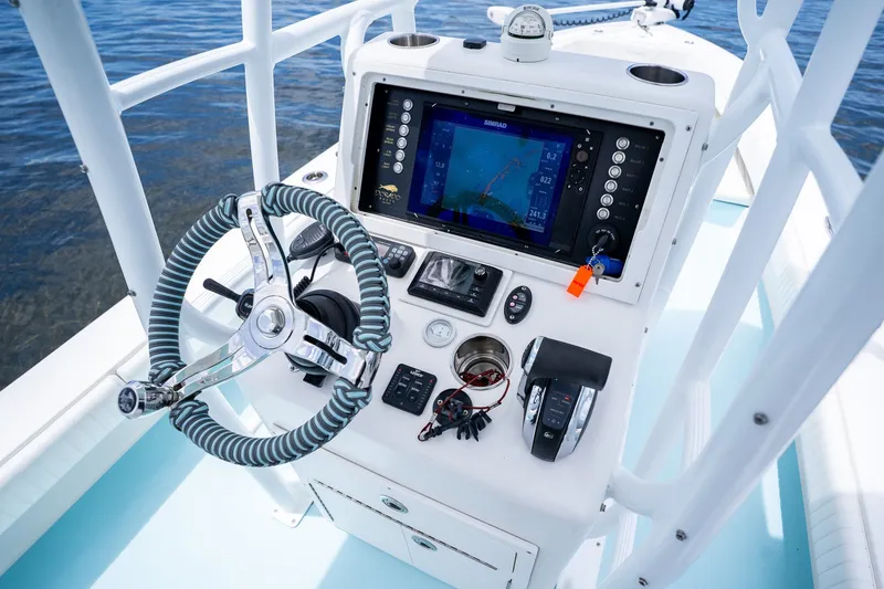 Slide: The Image of Control panel of a 2018 Dorado 25 SE boat with navigation equipment. - 31