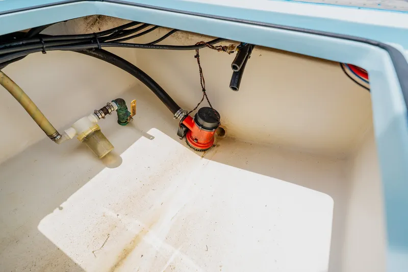 Slide: The Image of 2018 Dorado 25 SE boat compartment with pump and hoses. - 68