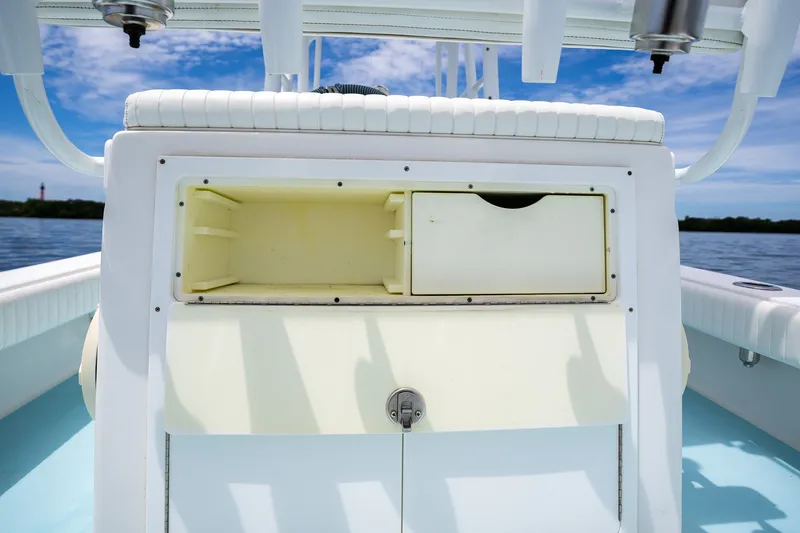 Slide: The Image of 2018 Dorado 25 SE boat storage compartment with ocean backdrop and clear sky. - 54