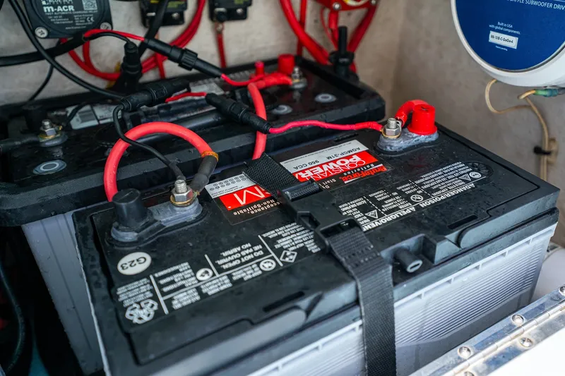Slide: The Image of Battery setup in a 2018 Dorado 25 SE boat with wiring connections. - 57