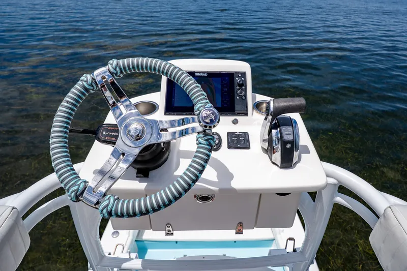 Slide: The Image of Steering console of 2018 Dorado 25 SE boat with navigation controls. - 47