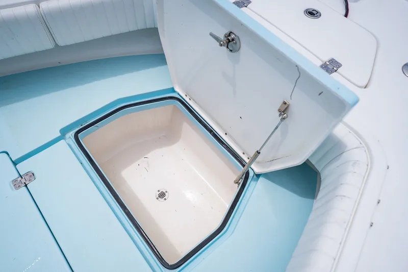 Slide: The Image of Open storage compartment on 2018 Dorado 25 SE boat deck. - 19