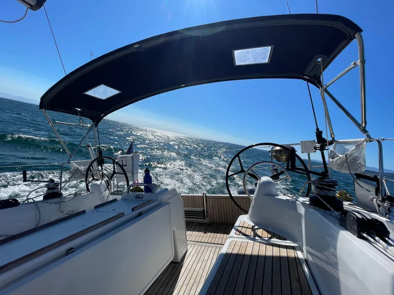 Slide: The Image of Jeanneau Sun Odyssey 410 sailing on open sea, clear blue sky, 2021 model. - 19