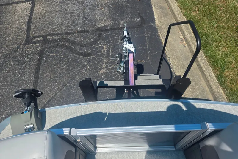 Slide: The Image of 2020 Avalon LSZ Cruise Rear Bench boat on trailer, parked on asphalt. - 26