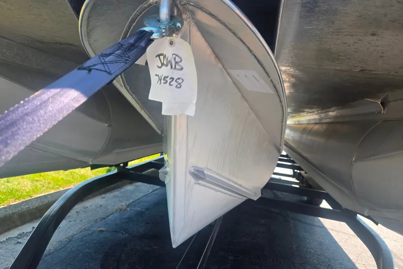 Slide: The Image of 2020 Avalon LSZ Cruise Rear Bench pontoon boat on trailer, close-up view. - 7