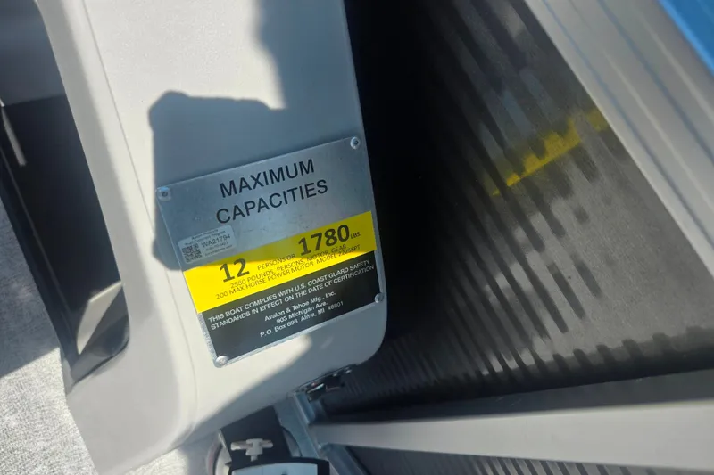 Slide: The Image of Maximum capacity label on 2020 Avalon LSZ Cruise Rear Bench boat, indicating 12 persons or 1780 lbs. - 23