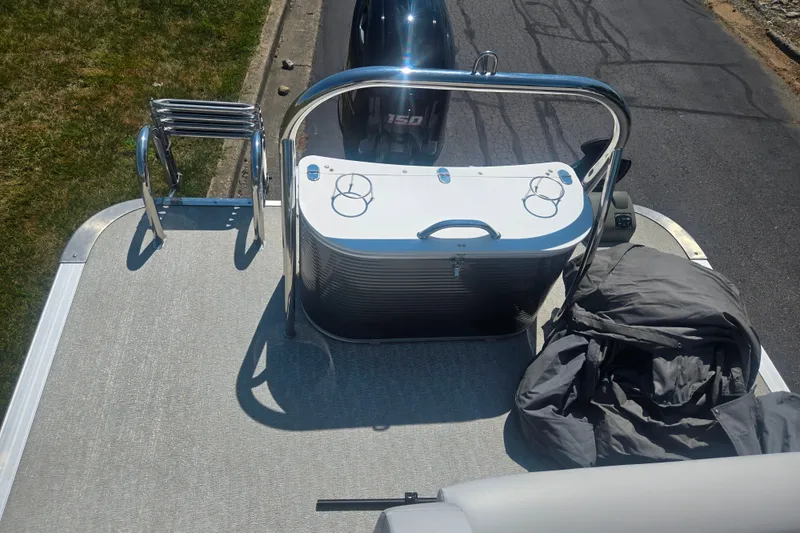 Slide: The Image of 2020 Avalon LSZ Cruise Rear Bench boat with motor and ladder on deck. - 17