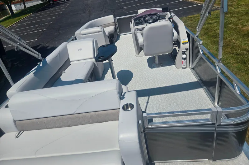 Slide: The Image of 2020 Avalon LSZ Cruise Rear Bench pontoon boat interior with seating and helm. - 21