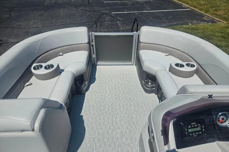Slide: The Image of 2020 Avalon LSZ Cruise Rear Bench boat interior with plush seating and cup holders. - 25