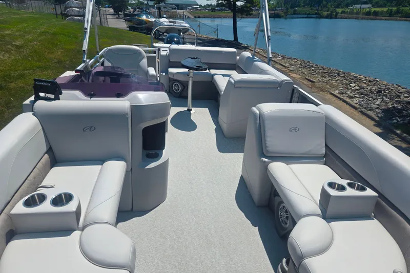 Slide: The Image of 2020 Avalon LSZ Cruise Rear Bench pontoon boat interior with plush seating and cup holders. - 11