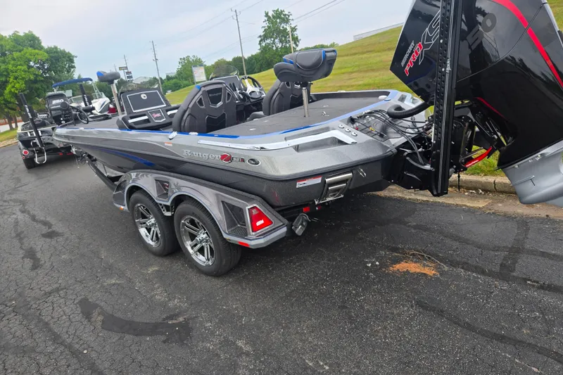 Slide: The Image of 2023 Ranger Z521R boat on trailer, featuring sleek design and powerful engine. - 3