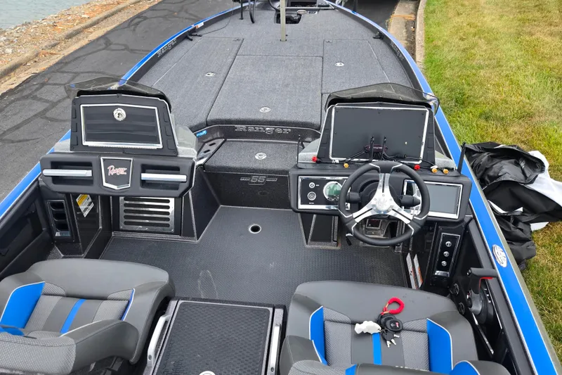 Slide: The Image of 2023 Ranger Z521R boat interior with steering wheel, seats, and control panels. - 10