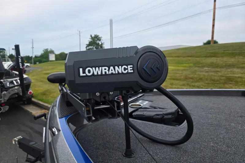 Slide: The Image of 2023 Ranger Z521R boat with Lowrance equipment, parked on a grassy area. - 5