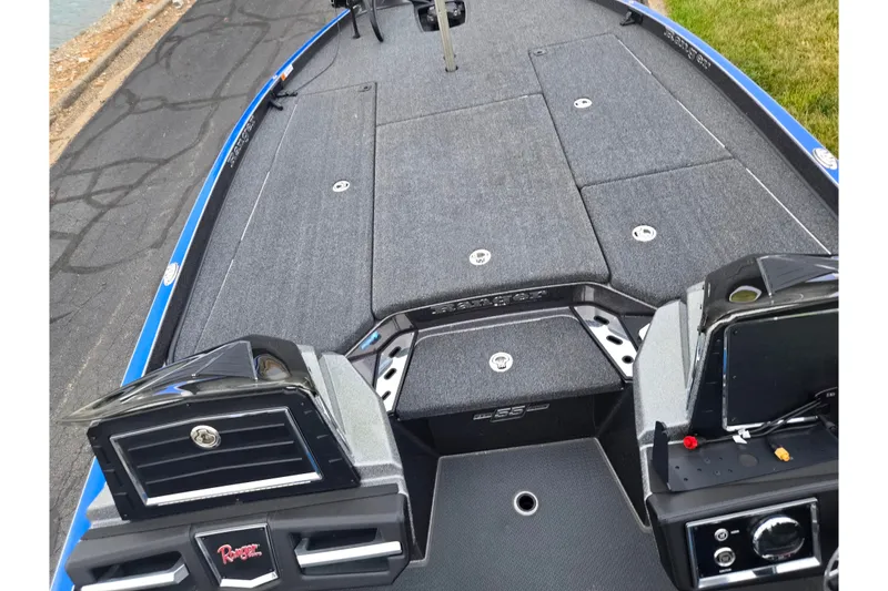 Slide: The Image of 2023 Ranger Z521R boat deck with advanced controls and storage compartments. - 12