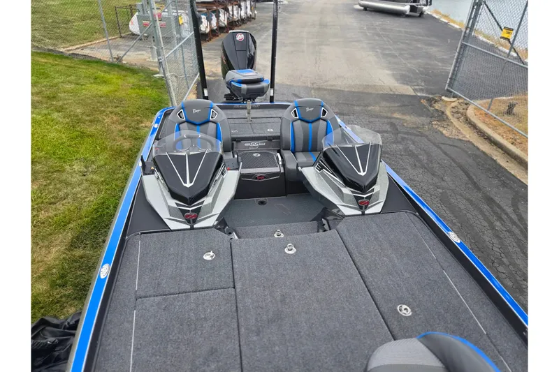 Slide: The Image of 2023 Ranger Z521R boat interior with dual seats and sleek design. - 16