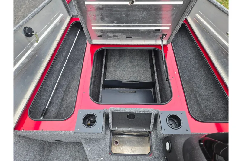 Slide: The Image of 2023 Tracker Pro Team 175 TXW boat interior with open storage compartments. - 14
