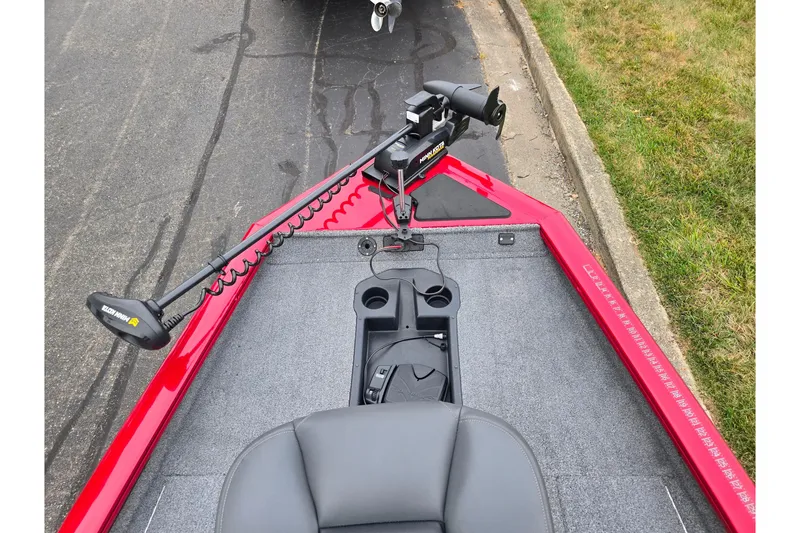 Slide: The Image of 2023 Tracker Pro Team 175 TXW boat with trolling motor on a paved road. - 15