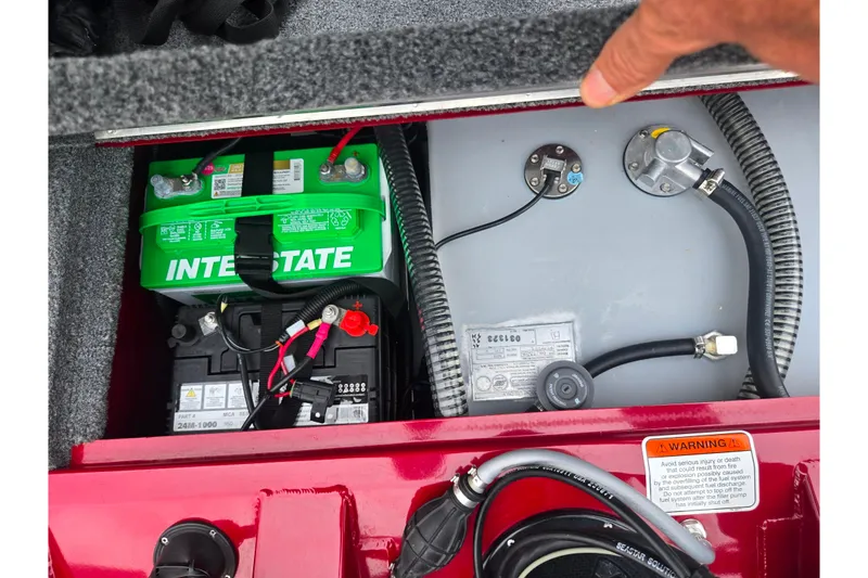 Slide: The Image of 2023 Tracker Pro Team 175 TXW boat battery and fuel system compartment. - 23