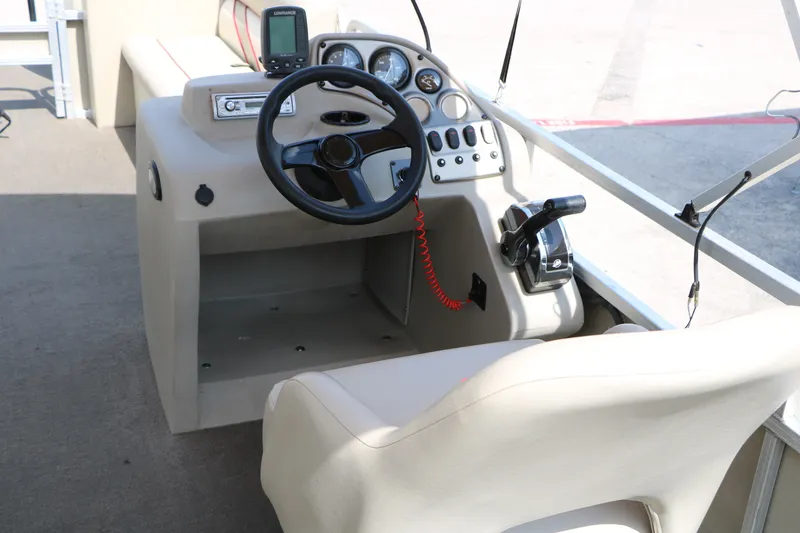 Slide: The Image of 2011 Sun Cruiser GS202 boat cockpit with steering wheel and control panel. - 17