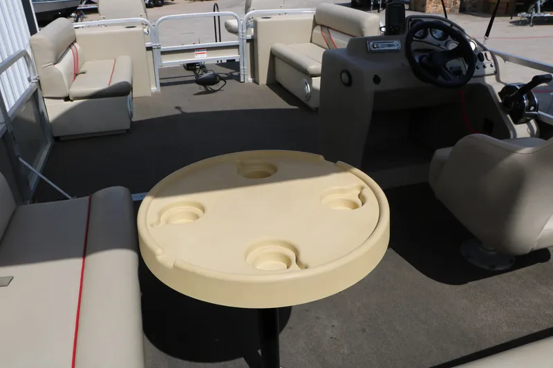Slide: The Image of Interior of 2011 Sun Cruiser GS202 pontoon boat with seating and steering console. - 16
