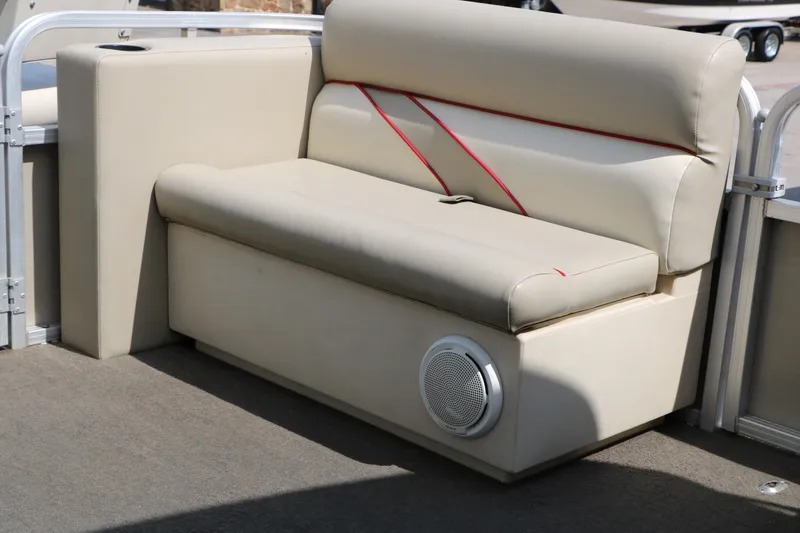 Slide: The Image of Beige seating on 2011 Sun Cruiser GS202 boat with red accents and built-in speaker. - 26