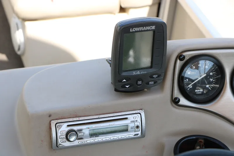 Slide: The Image of Dashboard of 2011 Sun Cruiser GS202 with Lowrance X-4 Pro and Sony stereo system. - 23