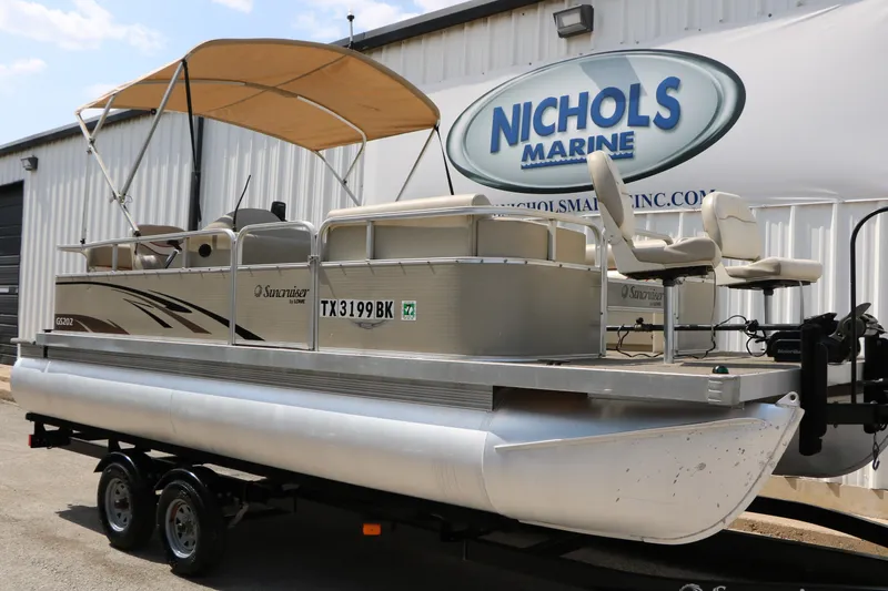 Slide: The Image of 2011 Sun Cruiser GS202 pontoon boat with canopy at Nichols Marine dealership. - 2