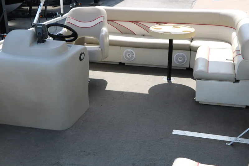 Slide: The Image of Interior of 2011 Sun Cruiser GS202 pontoon boat with seating and steering console. - 13