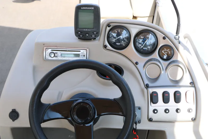Slide: The Image of Dashboard of 2011 Sun Cruiser GS202 boat with steering wheel and gauges. - 19