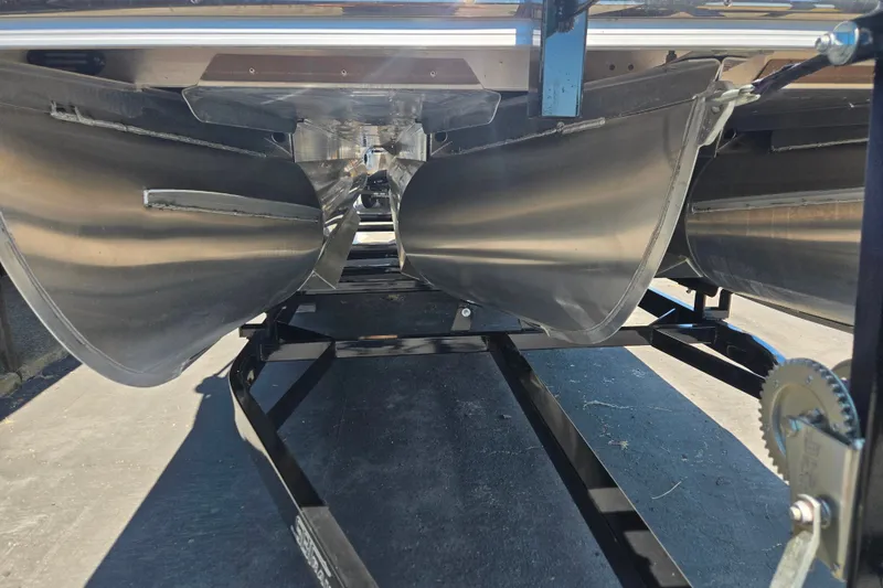Slide: The Image of Underneath view of a 2022 Bennington L24 pontoon boat on a trailer. - 12