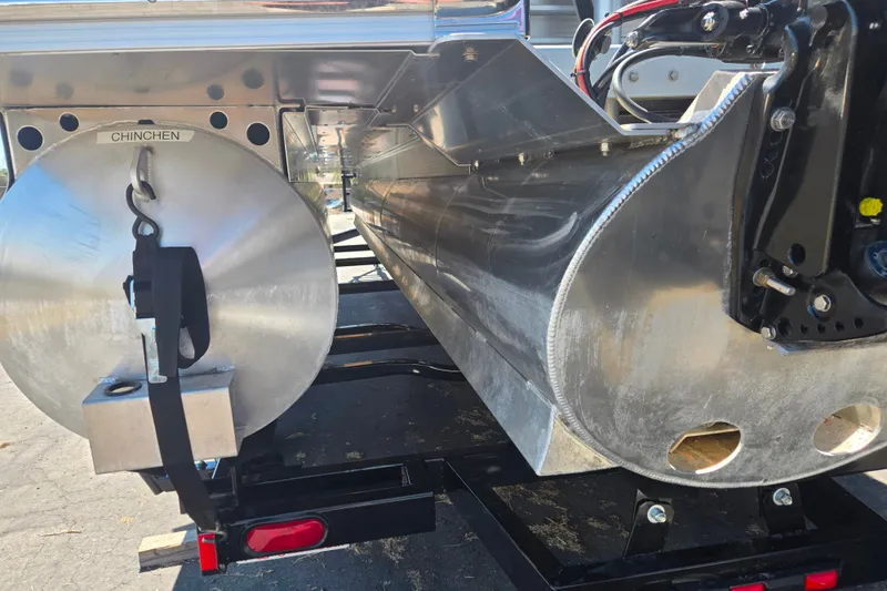Slide: The Image of Rear view of a 2022 Bennington L24 pontoon boat, showcasing its aluminum pontoons. - 4