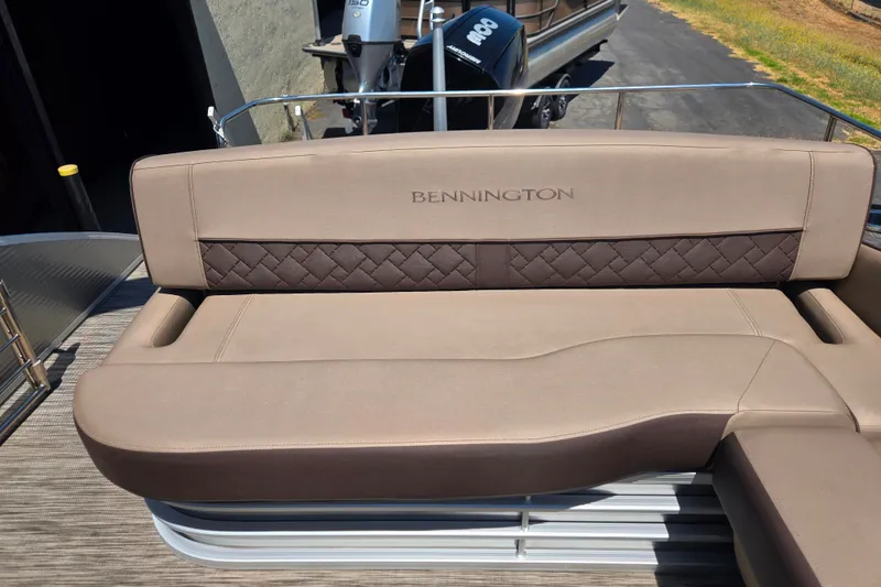 Slide: The Image of Luxurious seating on 2022 Bennington L24 pontoon boat with elegant design and comfortable upholstery. - 17