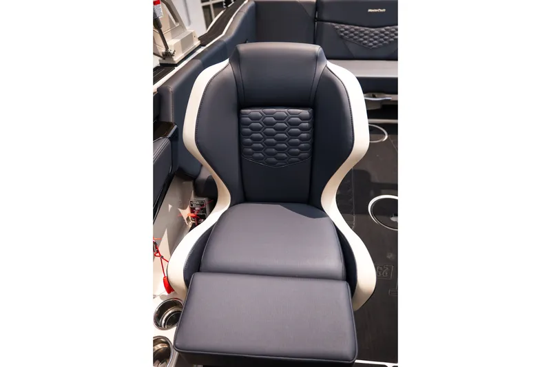 Slide: The Image of 2027 MasterCraft NXT23 boat seat with sleek black and white design. - 34