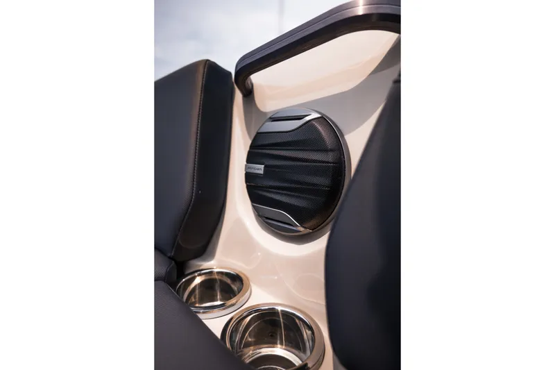 Slide: The Image of 2027 MasterCraft NXT23 boat interior with speaker and cup holders. - 26