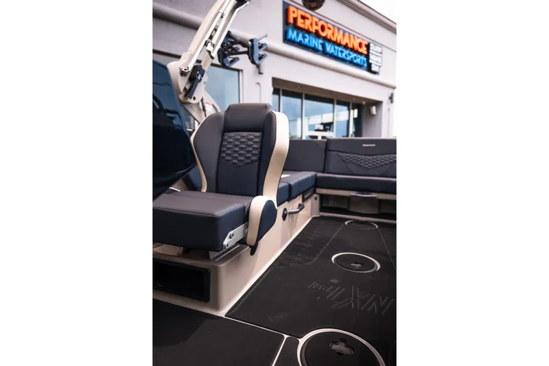 Slide: The Image of 2027 MasterCraft NXT23 boat interior with sleek seating at Performance Marine Watersports. - 28