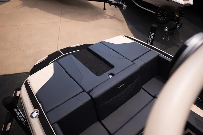 Slide: The Image of 2027 MasterCraft NXT23 boat interior with sleek, modern seating design. - 18