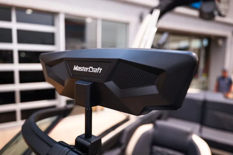 Slide: The Image of 2027 MasterCraft NXT23 boat rearview mirror, showcasing sleek design and branding. - 33
