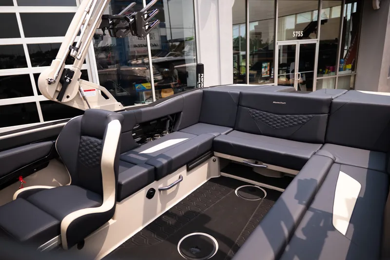 Slide: The Image of 2027 MasterCraft NXT23 boat interior with luxurious seating and modern design. - 14