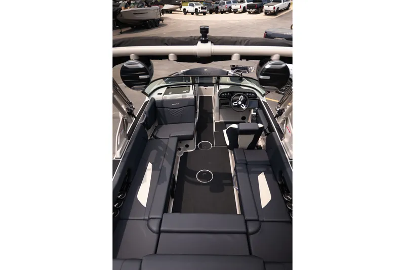 Slide: The Image of Interior view of 2027 MasterCraft NXT23 boat with sleek seating and modern dashboard. - 19