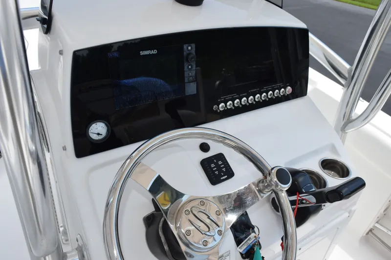 Slide: The Image of 2015 Sportsman Open 212 Center Console dashboard with steering wheel and controls. - 9
