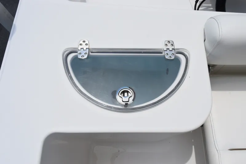 Slide: The Image of 2015 Sportsman Open 212 Center Console boat livewell with transparent lid and latch. - 15