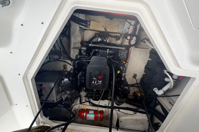 Slide: The Image of Engine compartment of a 2007 Sea Ray 240 Sundancer boat, featuring a MerCruiser engine. - 18