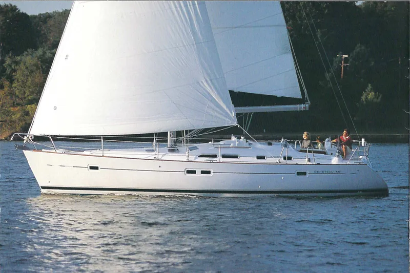 Slide: The Image of 2003 Beneteau 423 sailboat cruising on calm waters with full sails. - 11
