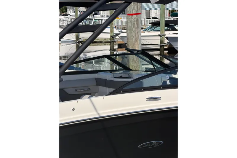 The Image of 2023 Sea Ray 270 Sundeck boat docked, showcasing sleek design and modern features. - 1