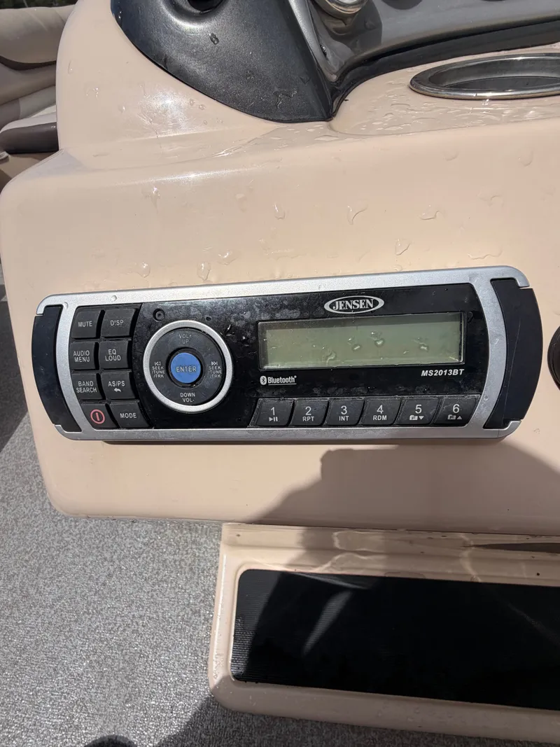 Slide: The Image of A Jensen audio system is installed in the dashboard of a 2015 Sun Tracker Party Barge 22 DLX. - 15