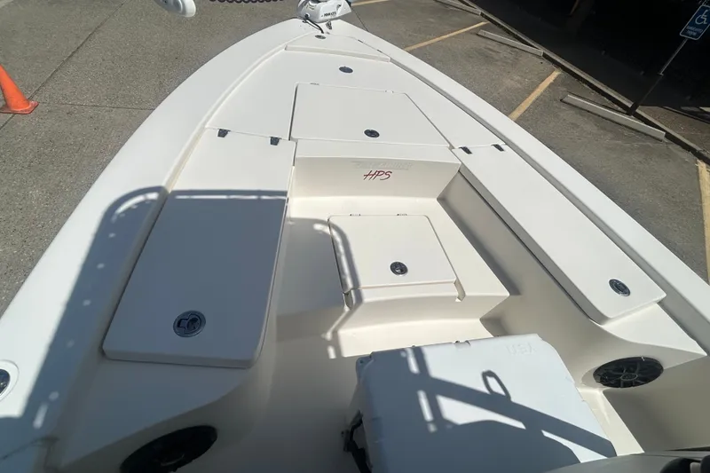 Slide: The Image of 2013 Pathfinder 2300 HPS boat deck with storage compartments and seating. - 4