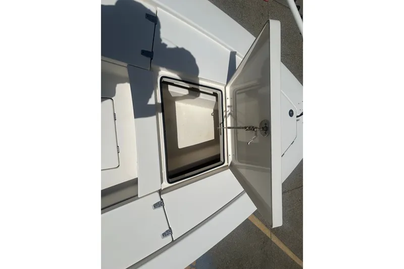 Slide: The Image of Open storage compartment on a 2013 Pathfinder 2300 HPS boat, showcasing interior space. - 5