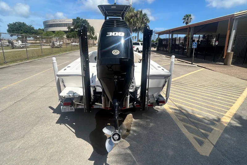 Slide: The Image of 2013 Pathfinder 2300 HPS boat with powerful 300 HP engine in parking lot. - 3