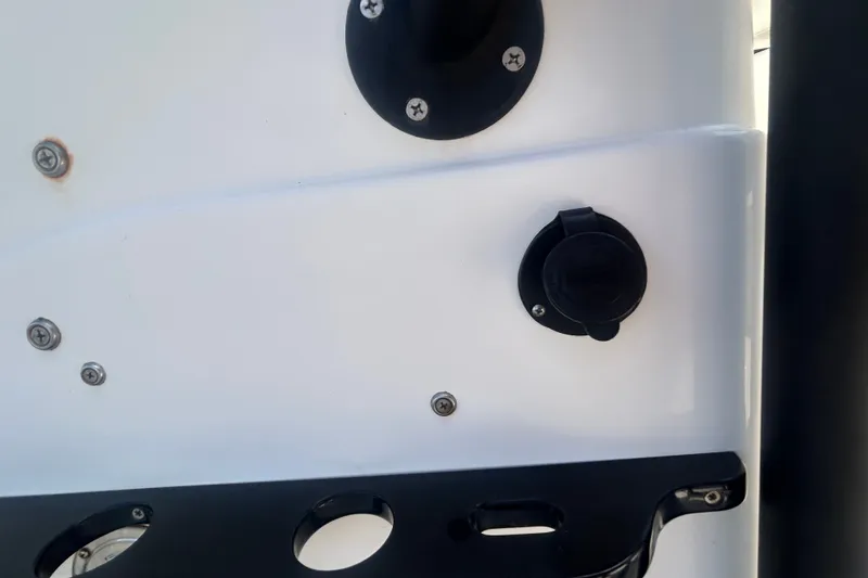 Slide: The Image of Close-up of 2013 Pathfinder 2300 HPS boat's side panel with screws and fittings. - 20